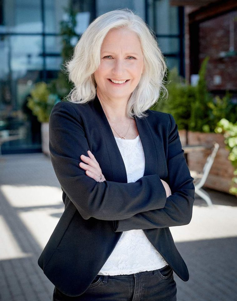 Ingrid professional Portrait for her new book. Photograph outdoors with the blurred background