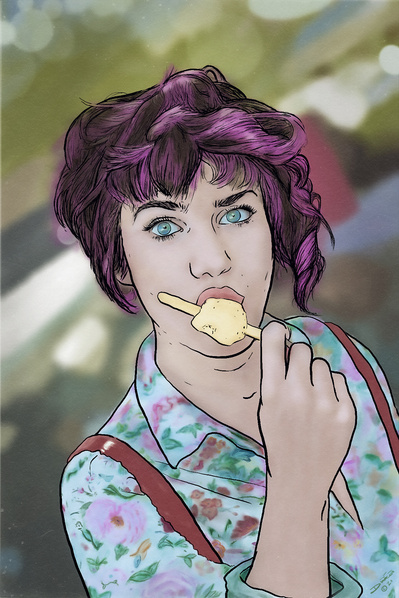 Portrait of a young woman eating an ice pop on a summer's day.