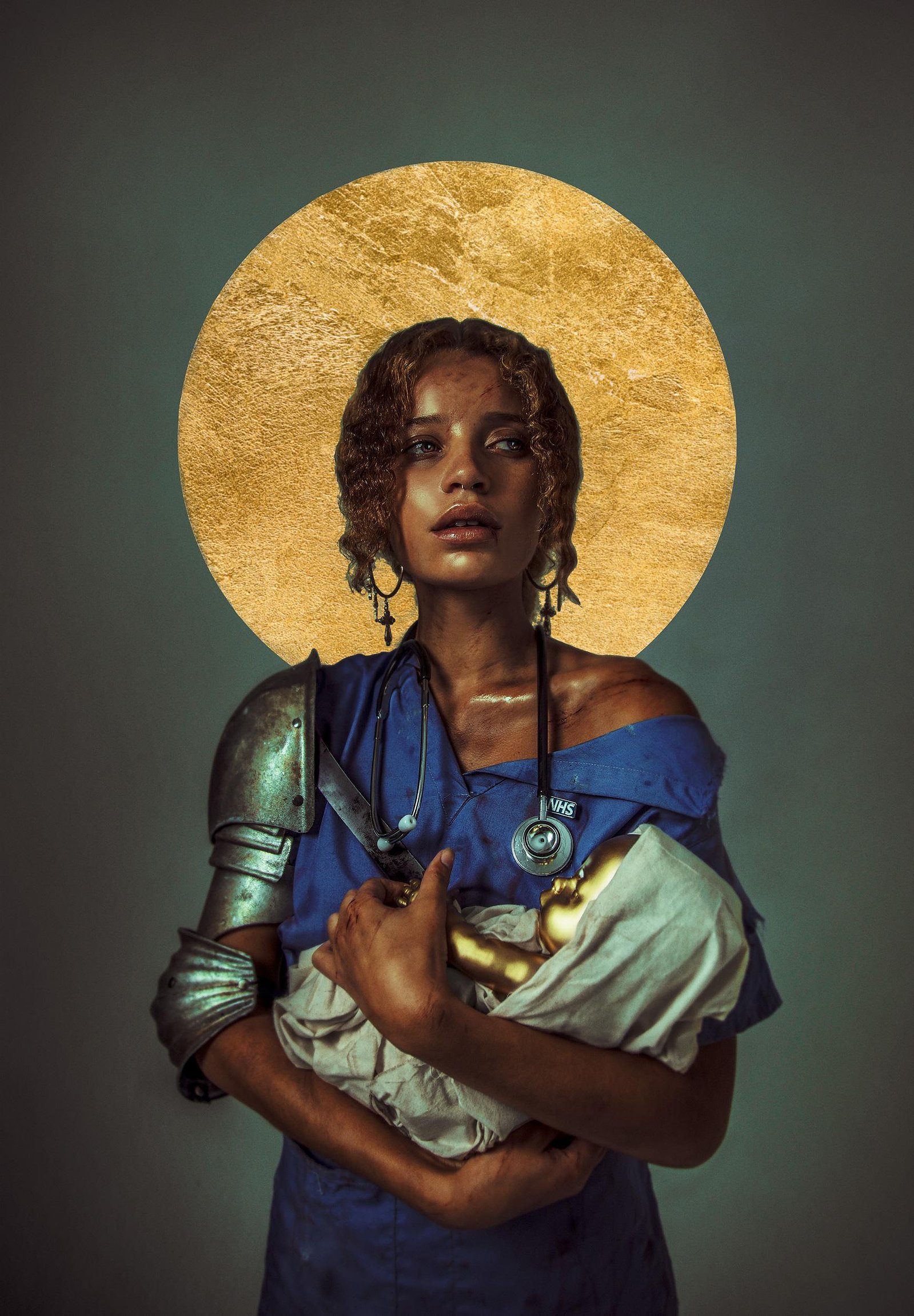 A cyborg madonna nurses a robot baby forged out of gold.