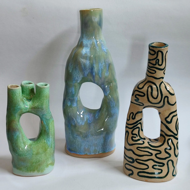 three handmade ceramic vases with interesting shapes and colours. 