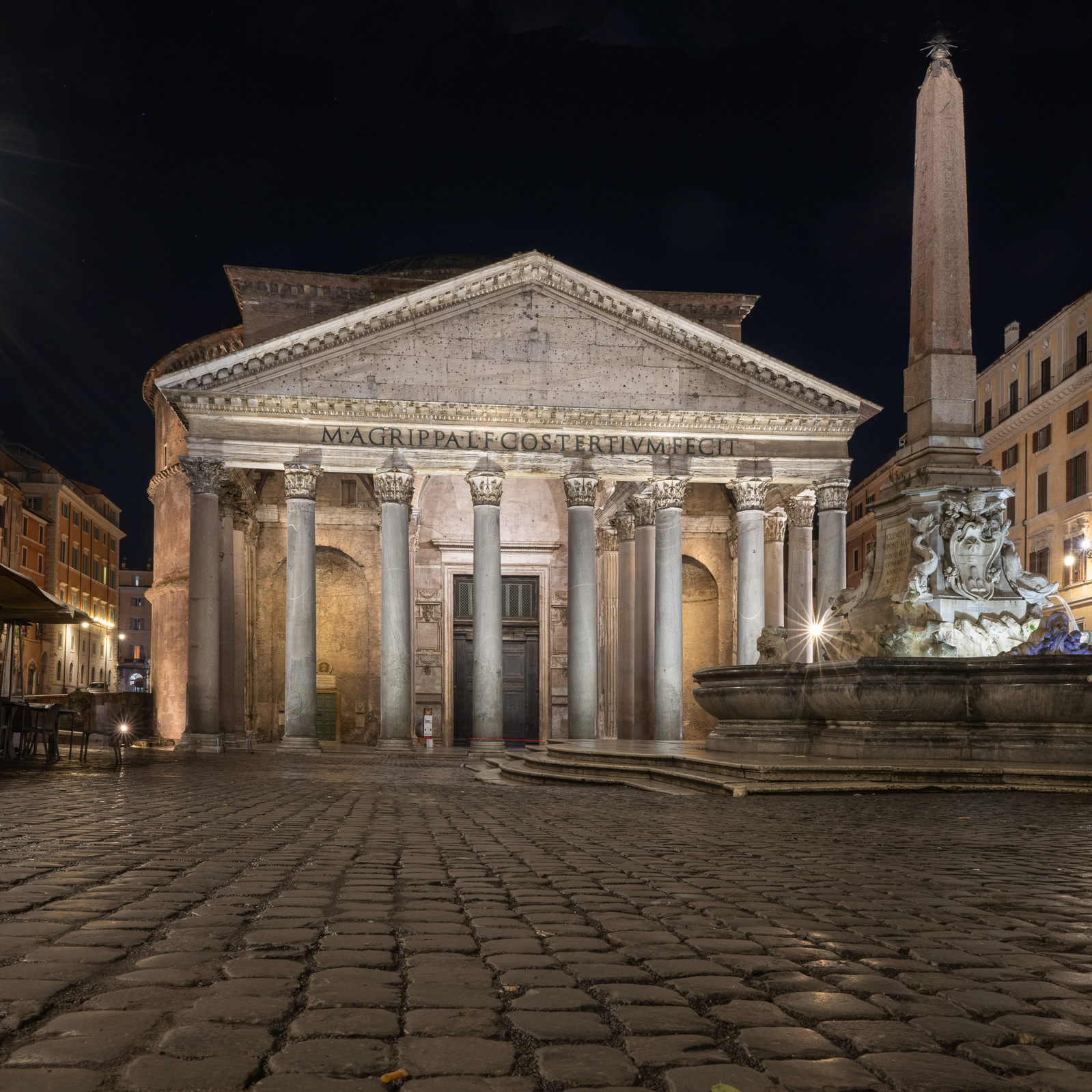 Night view of Pantheon in Rome showing cobblestones in foreground creating leading lines leading viewer's eye to the front of the Pantheon
