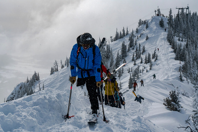 A skier with one leg, Vasu Sojitra, cruises along the "ridge"  at Bridger Bowl ski area in Montana on the way to enjoy some skiing.