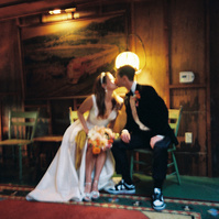 Intimate kissing film shot of bride and groom, captured by Abigail Gorden Photography. A romantic and heartfelt moment on their wedding day.