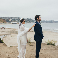 Wedding photography of a first look moment with bride and groom shot in Malibu, California.
