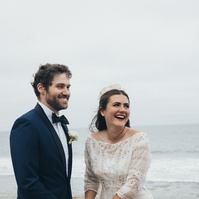 Romantic wedding photography of a bride and groom exchanging vows in Malibu, CA.