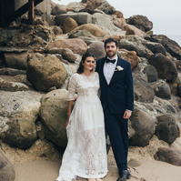 Wedding photography of bride and groom shot at the beach in Duke's Malibu, California by Los Angeles-based wedding photographer Abigail Gorden Photography.