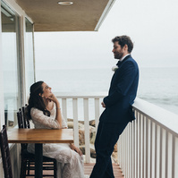 Wedding photography of bride and groom shot at the beach in Duke's Malibu, California by Los Angeles-based wedding photographer Abigail Gorden Photography.