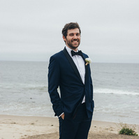 Wedding photography of groom waiting for bride on an overcast wedding day in Malibu, California.