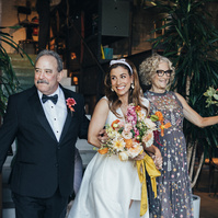 Candid parents walking the bride to the altar, captured by Abigail Gorden Photography. A heartfelt and emotional moment at the wedding ceremony.