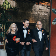 Candid parents walking the groom to the altar, captured by Abigail Gorden Photography. A heartfelt and emotional moment at the wedding ceremony.
