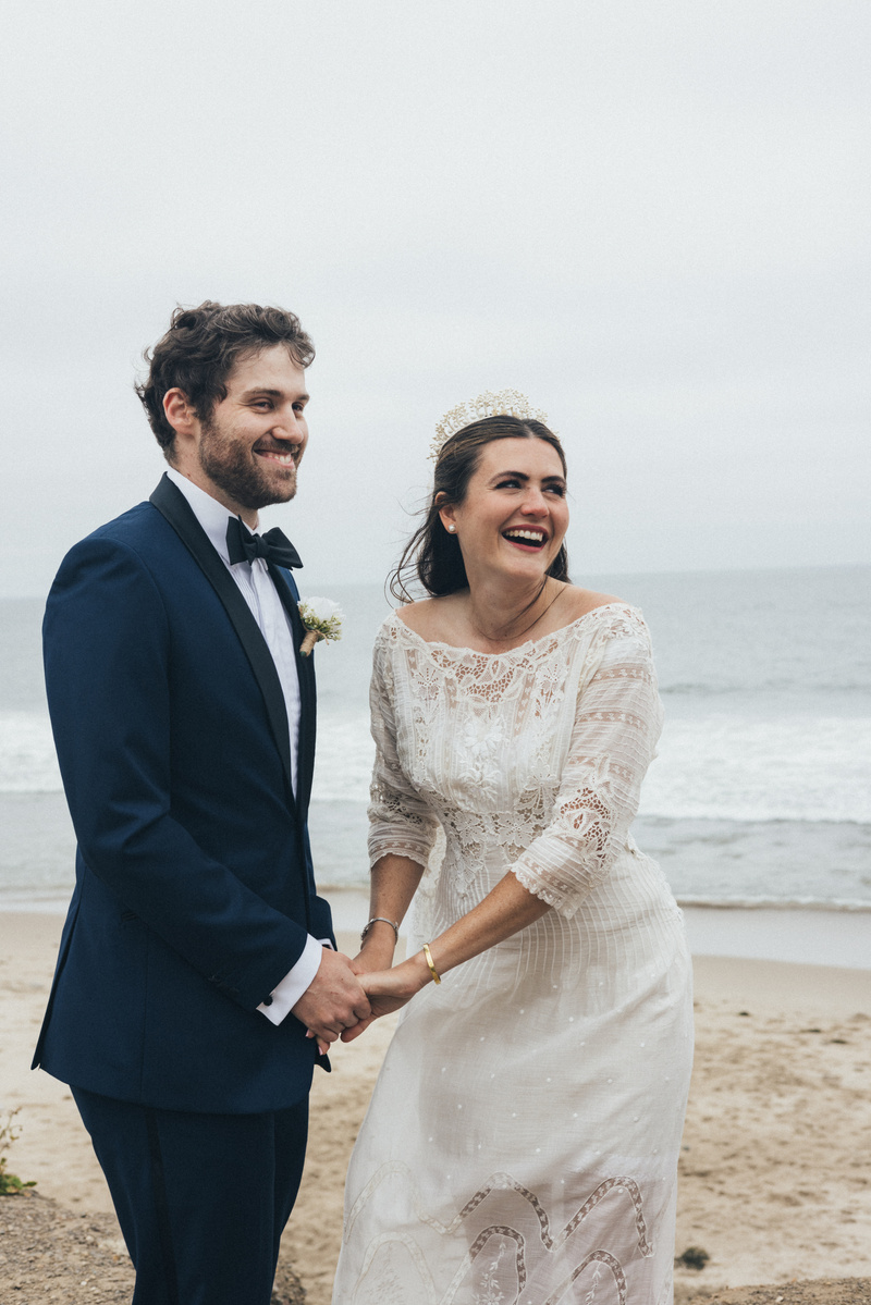 Romantic wedding photography of a bride and groom exchanging vows in Malibu, CA.