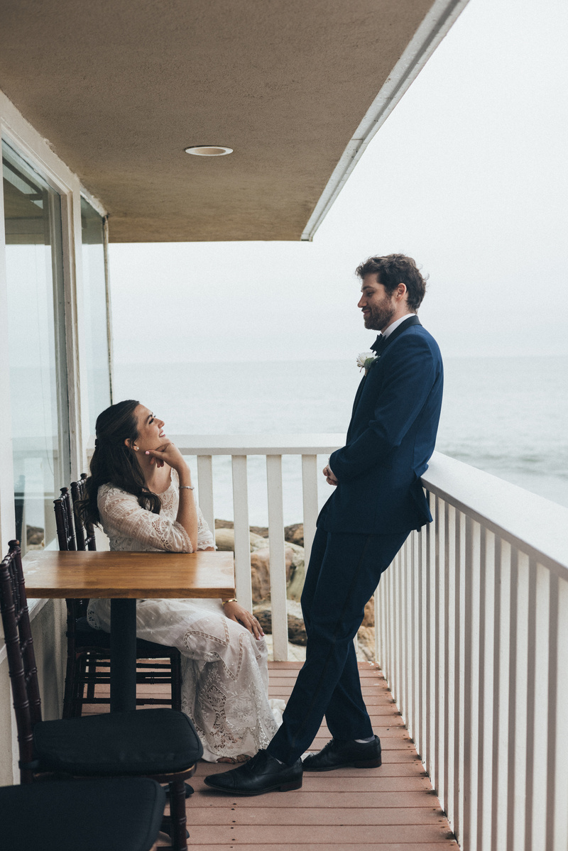 Wedding photography of bride and groom shot at the beach in Duke's Malibu, California by Los Angeles-based wedding photographer Abigail Gorden Photography.