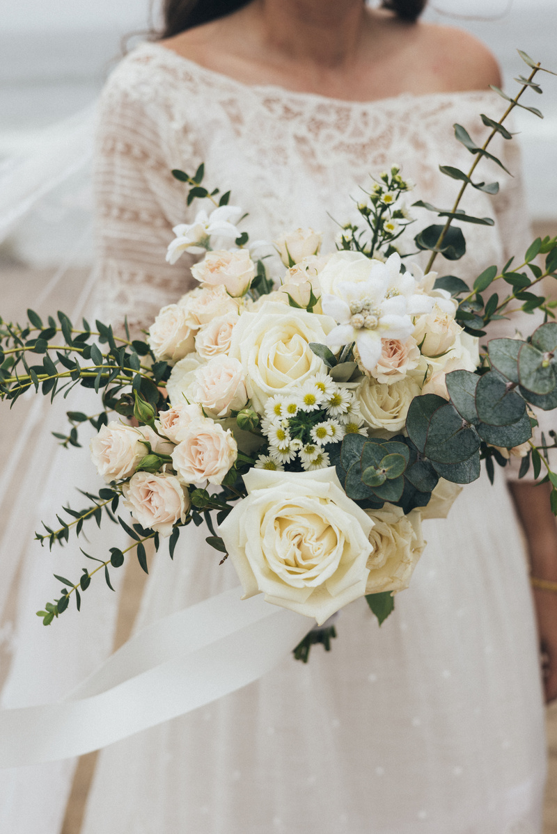 Wedding photography of an elegant bridal bouquet shot at the beach in Malibu, California.