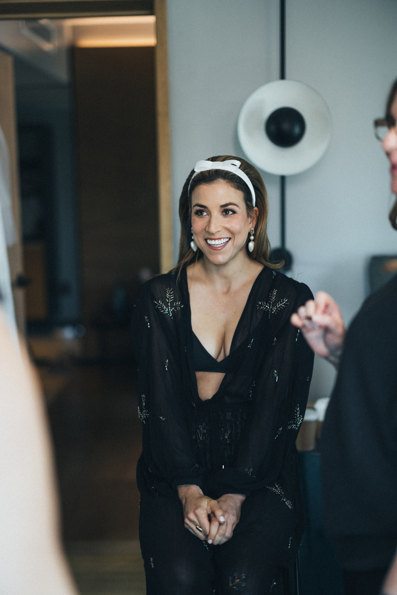 Candid bride getting ready.