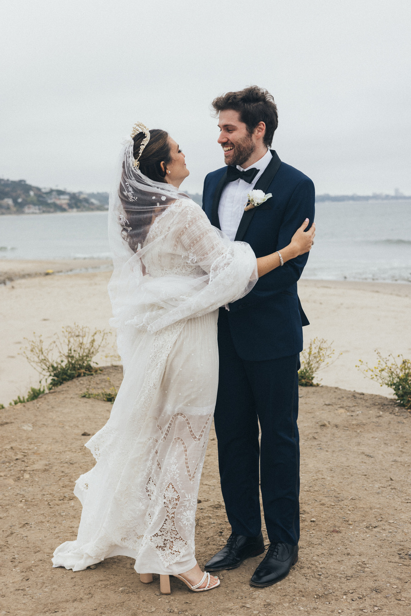Wedding photography of a first look moment with bride and groom shot in Malibu, California.