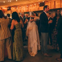 Candid wedding photography of a bride and her guests shot at Duke's Malibu in California by wedding photographer Abigail Gorden Photography.