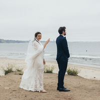 Wedding photography of a first look moment with bride and groom shot in Malibu, California.