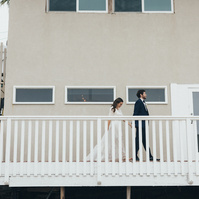 Wedding photography of bride and groom shot at the beach in Duke's Malibu, California by Los Angeles-based wedding photographer Abigail Gorden Photography.