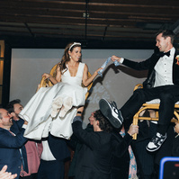 Candid energetic hora dance at the wedding, captured by Abigail Gorden Photography. A lively and joyful celebration of love and Jewish tradition.