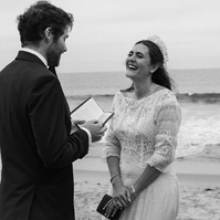 Romantic and intimate black and white wedding photography of a bride and groom exchanging vows in Malibu, CA.