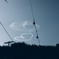 Hearts in the sky wedding photo, captured by Abigail Gorden Photography. A dreamy and romantic moment above the celebration.