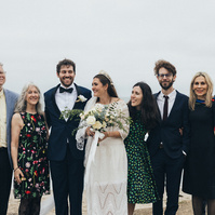 Wedding photography of a family shot in coastal scenery- Malibu Beach, California.