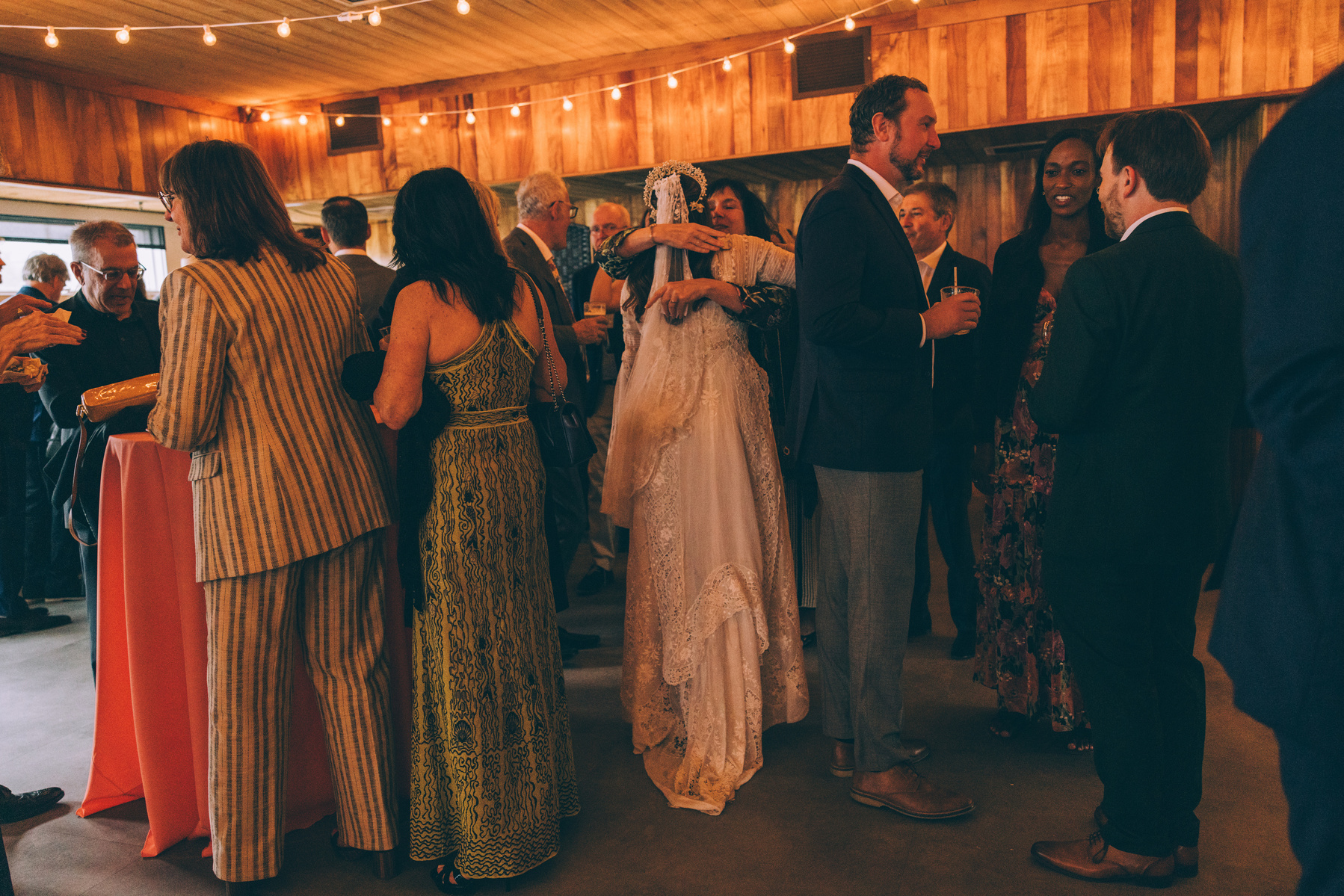 Candid wedding photography of a bride and her guests shot at Duke's Malibu in California by wedding photographer Abigail Gorden Photography.