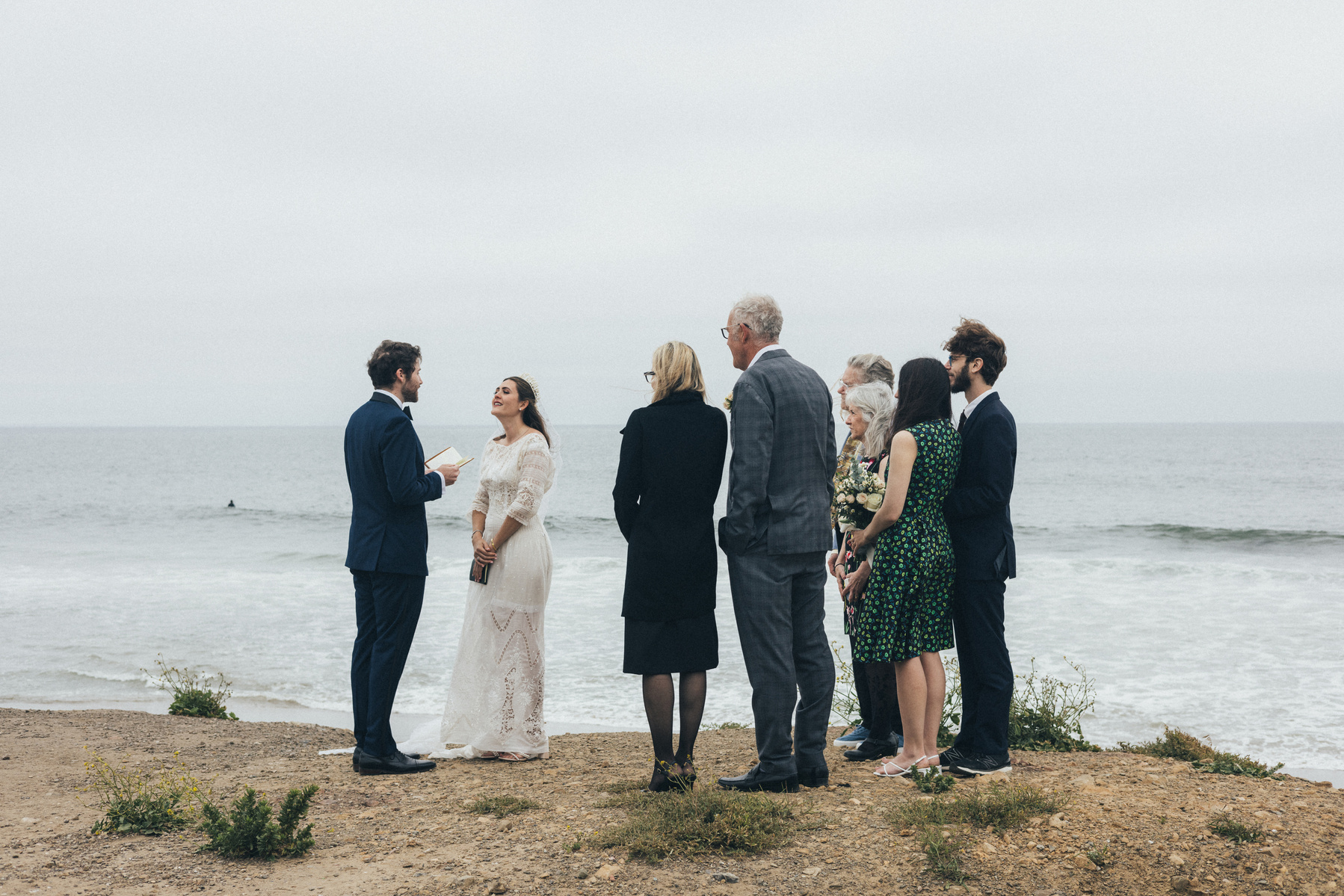 Wedding ceremony photography of a family and the bride and groom on a beach in Malibu, CA.