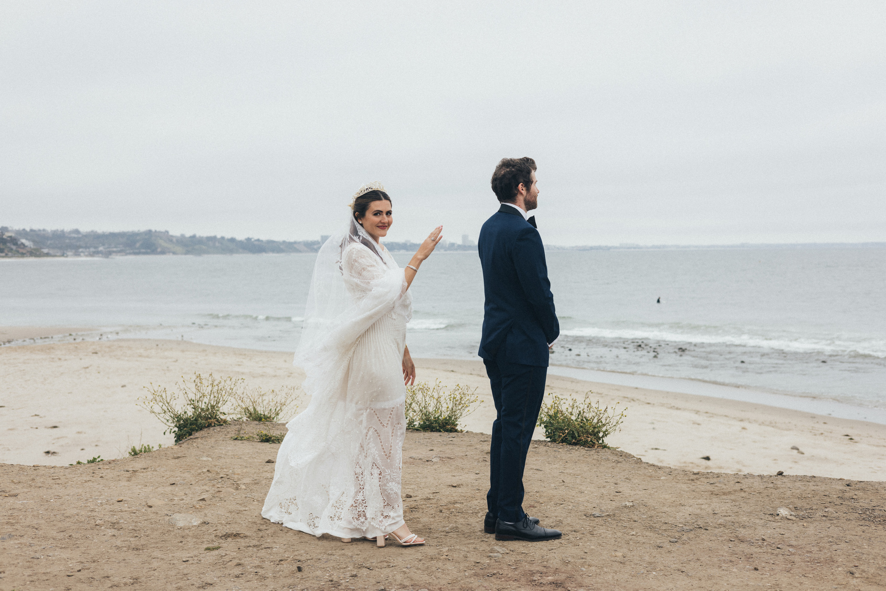 Wedding photography of a first look moment with bride and groom shot in Malibu, California.