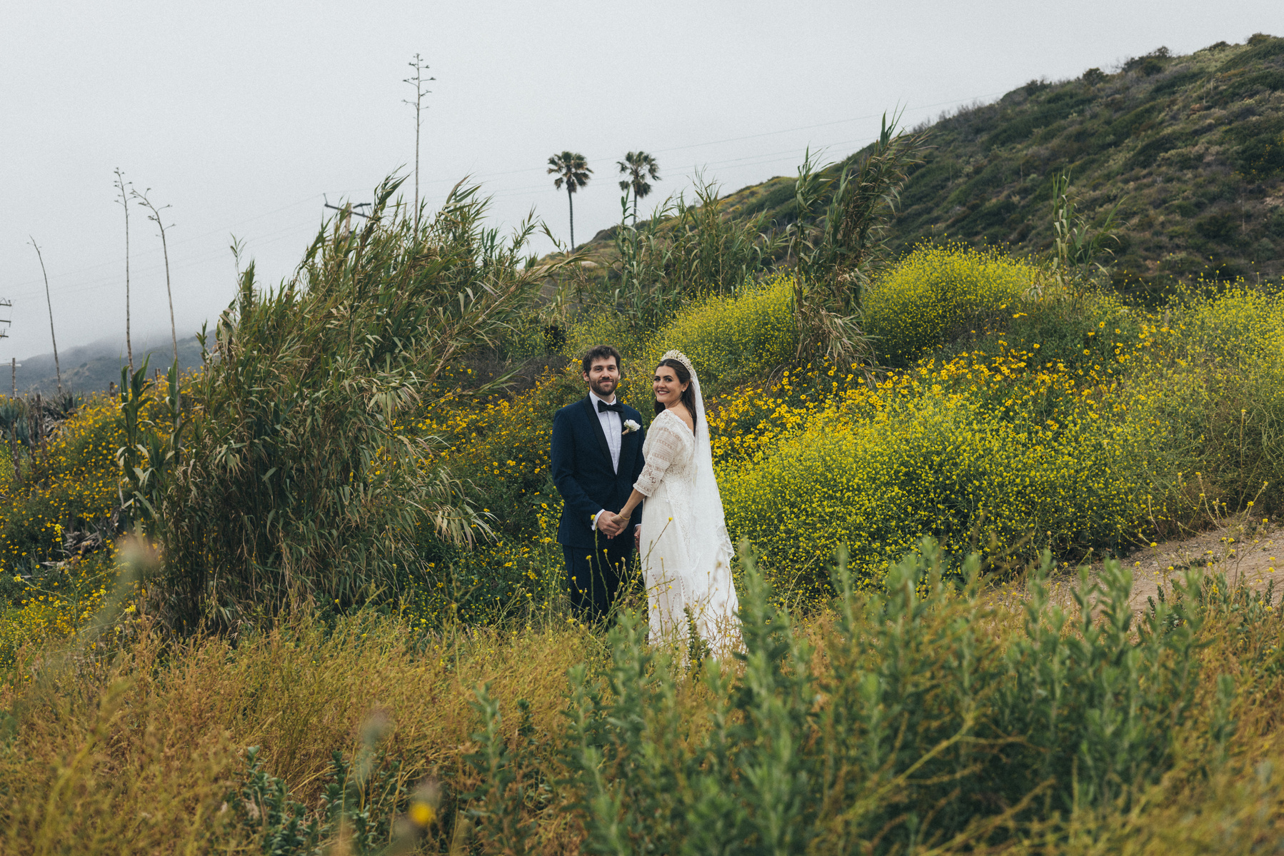 Romantic wedding photography of a bride and groom amongst coastal scenery in Malibu, CA shot by wedding photographer Abigail Gorden Photography.
