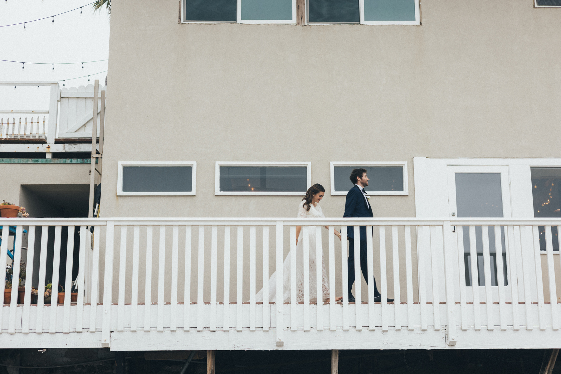 Wedding photography of bride and groom shot at the beach in Duke's Malibu, California by Los Angeles-based wedding photographer Abigail Gorden Photography.