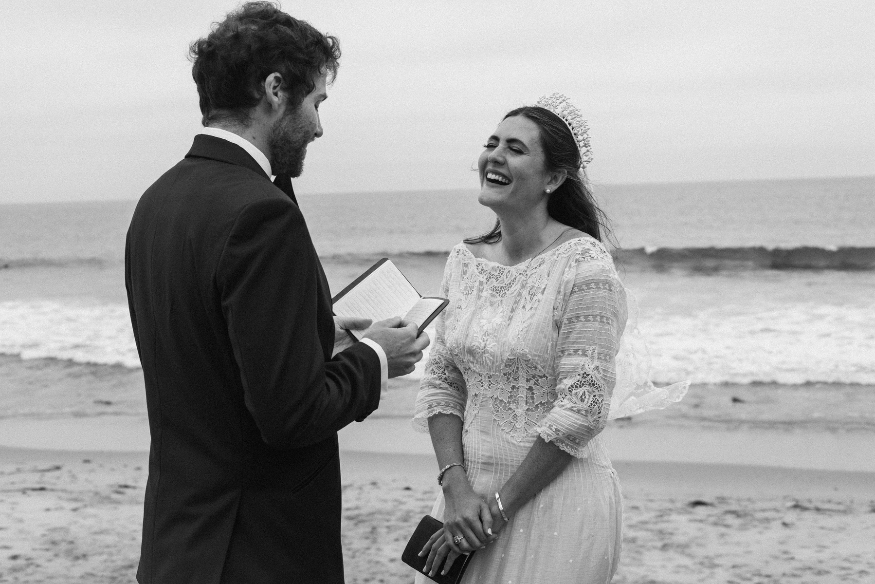 Romantic and intimate black and white wedding photography of a bride and groom exchanging vows in Malibu, CA.