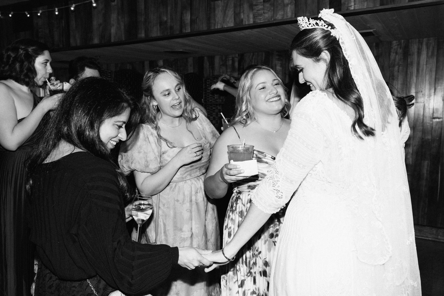 Elegant black and white flash wedding photography shot at Duke's Malibu, CA by wedding photographer Abigail Gorden.