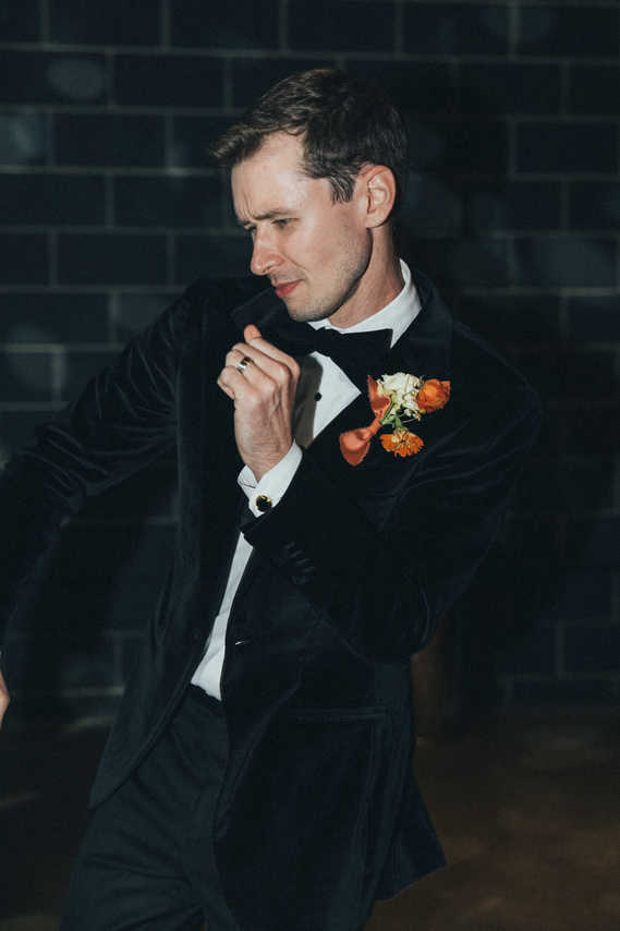 Candid groom dancing on the floor at The SmogShoppe, captured by Abigail Gorden Photography. A lively moment celebrating love and joy.