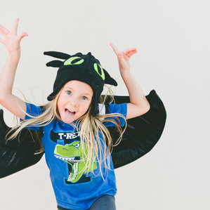 Tomboy girl plays in costume