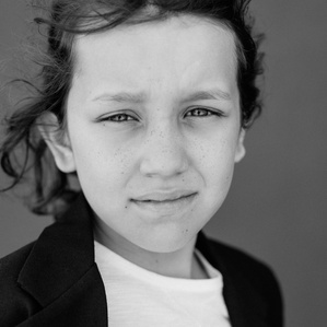 Boy stares at camera in black and white