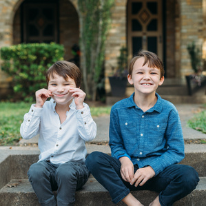Brothers being silly on the front steps at home