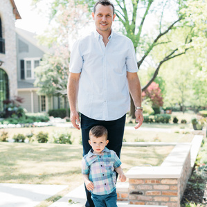 Father Craig Dahl and son stand together in front yard