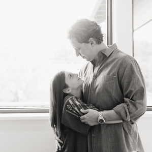 Dad looks lovingly at daughter