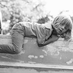 Boy lays on boat