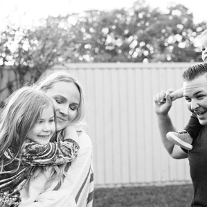 Family together in backyard