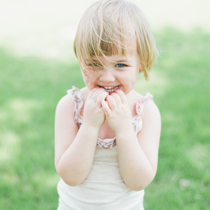 Little girl giggles in park