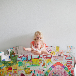 Big sister squeezes little sister inside castle 