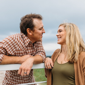 Mother and Father look lovingly at each other