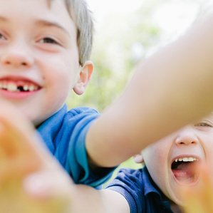 Brothers reach out to camera together