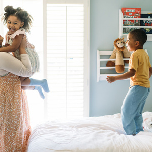 Mother catches daughter while son jumps on bed