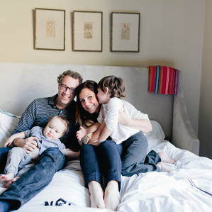Family of 4 on bed