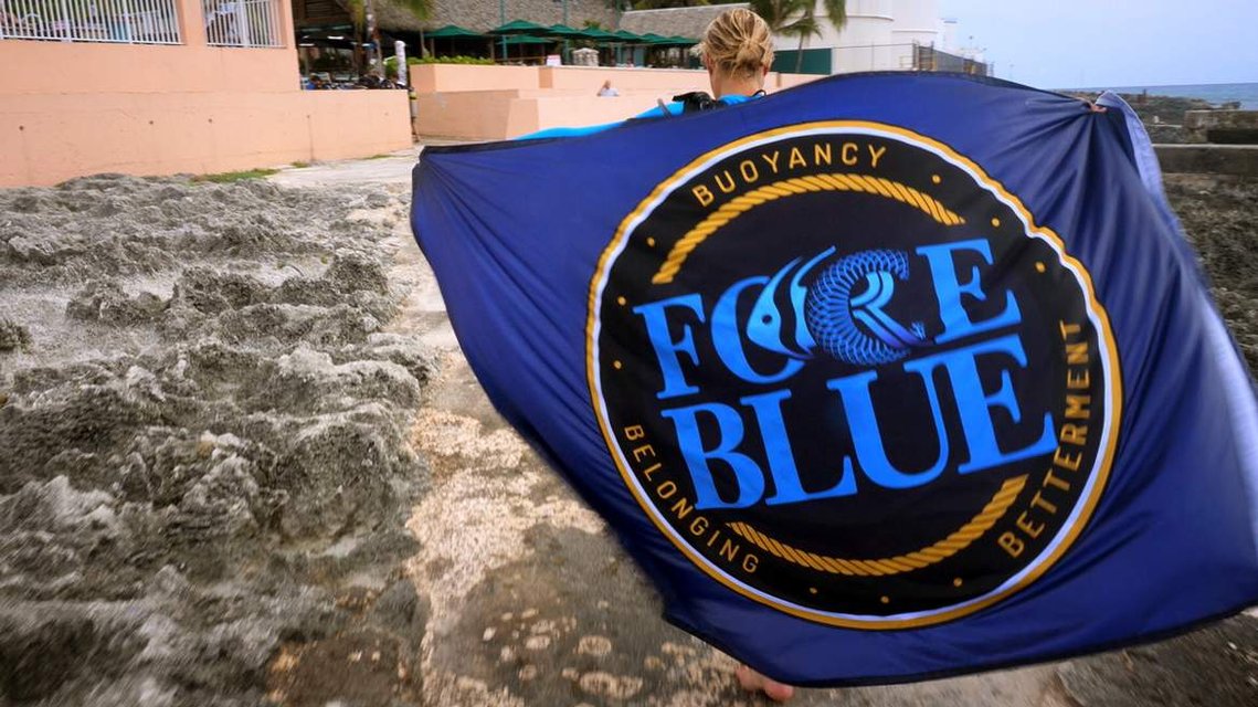 FORCE BLUE: TEAM ONE MEMBER WITH FORCE BLUE FLAG