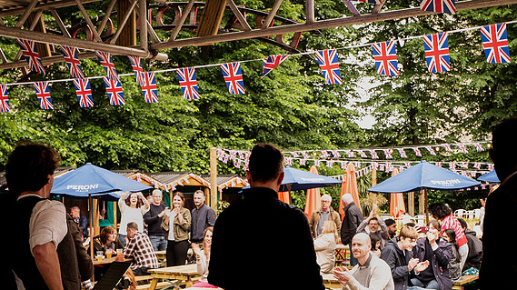 The vibrant beer garden of The Drayton Court Pub & Hotel, Ealing, London. The location of the Puppy Pool Pawty and Woof Photography pop-up photoshoot. 
