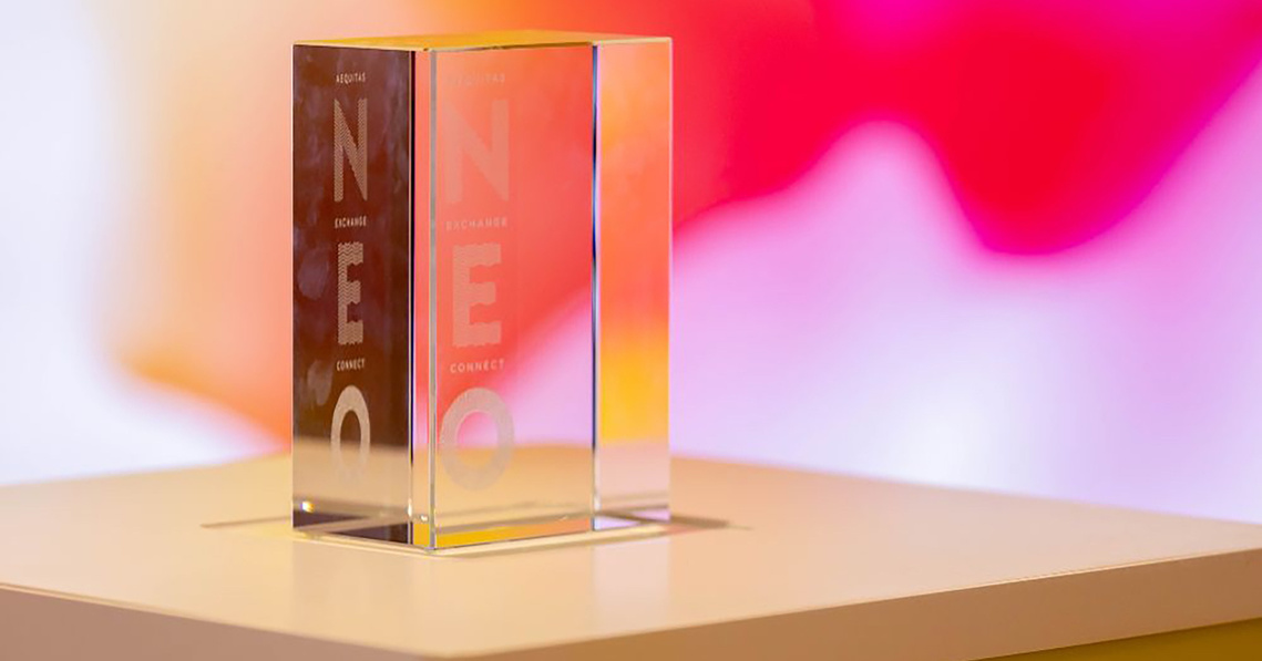 A small glass rectangle with the Neo logo on the inside